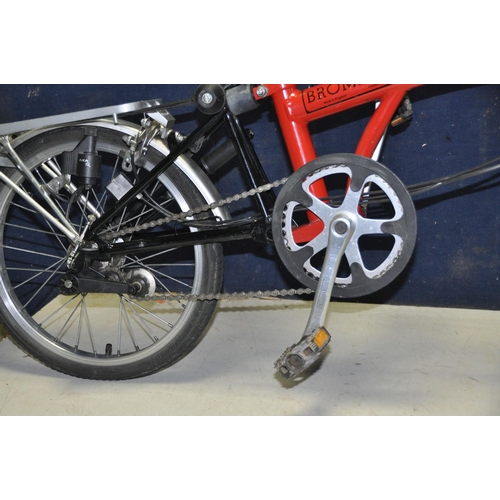 1102 - A BROMPTON FOLDING BIKE WITH BAG in red