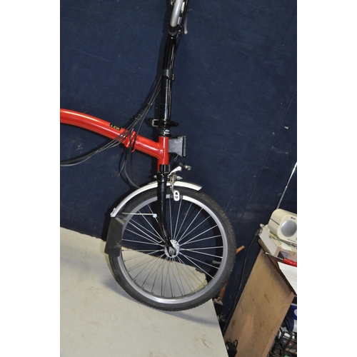 1102 - A BROMPTON FOLDING BIKE WITH BAG in red