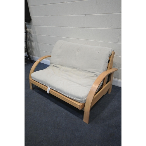 1375 - A MODERN BEECH FOLDING FUTON, length 141cm