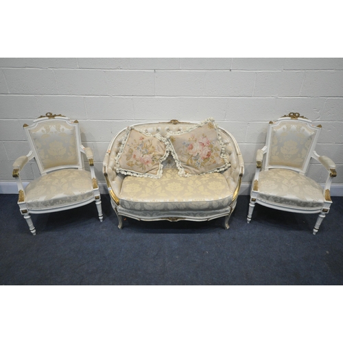 1377 - A 20TH CENTURY CREAM AND GILT PAINTED FRENCH SOFA, with an arched back, length 122cm, and a pair of ... 