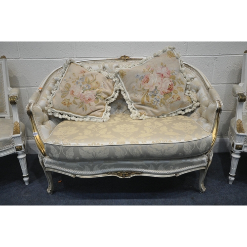 1377 - A 20TH CENTURY CREAM AND GILT PAINTED FRENCH SOFA, with an arched back, length 122cm, and a pair of ... 