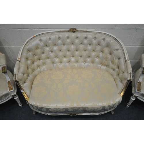 1377 - A 20TH CENTURY CREAM AND GILT PAINTED FRENCH SOFA, with an arched back, length 122cm, and a pair of ... 