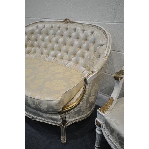 1377 - A 20TH CENTURY CREAM AND GILT PAINTED FRENCH SOFA, with an arched back, length 122cm, and a pair of ... 