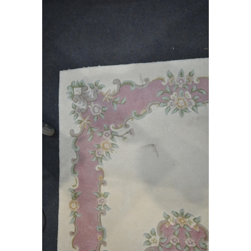 1386 - A LATE 20TH CENTURY CREAM AND PINK CHINESE RUG, 237cm x 148cm