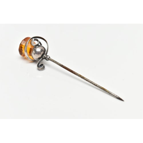 1 - AN EARLY 20TH CENTURY 'CHARLES HORNER' HAT PIN, white metal scrolling around an orange paste thistle... 