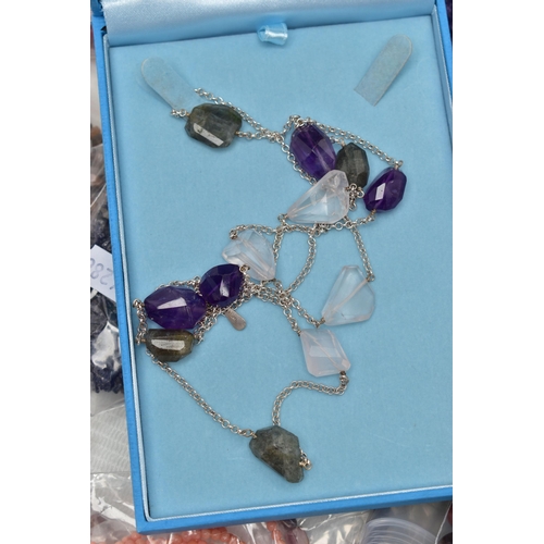 101 - A LARGE COLLECTION OF SEMI-PRECIOUS GEMSTONE JEWELLERY, to include a boxed pink agate pendant, in a ... 