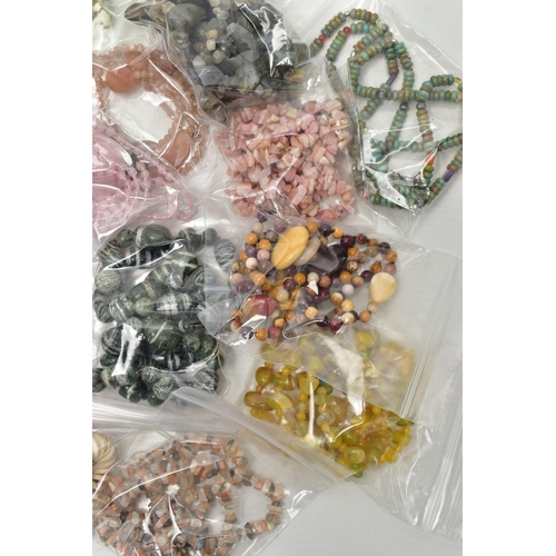 101 - A LARGE COLLECTION OF SEMI-PRECIOUS GEMSTONE JEWELLERY, to include a boxed pink agate pendant, in a ... 