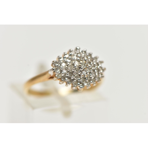 16 - A 9CT YELLOW GOLD, DIAMOND CLUSTER RING, of a marquise shape, set with single cut diamonds, pinched ... 