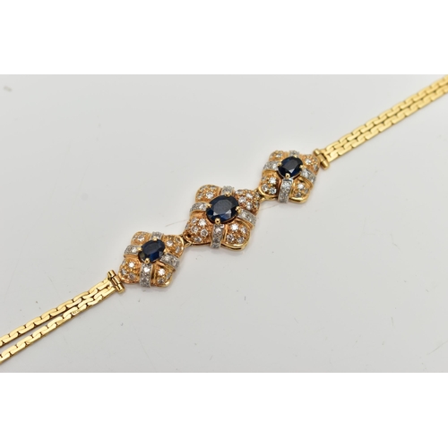 26 - A 18CT GOLD DIAMOND AND SAPPHIRE BRACELET, three oval cut blue sapphires each set in a quatrafoil mo... 