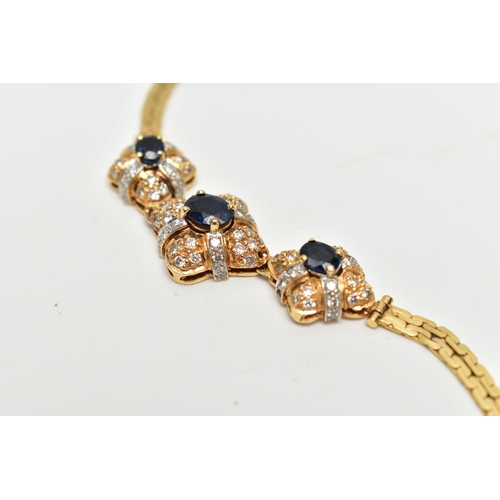 26 - A 18CT GOLD DIAMOND AND SAPPHIRE BRACELET, three oval cut blue sapphires each set in a quatrafoil mo... 