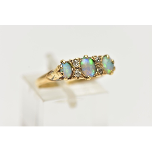 40 - AN EARLY 20TH CENTURY 18CT GOLD, OPAL AND DIAMOND RING, designed with three oval opal cabochons, eac... 