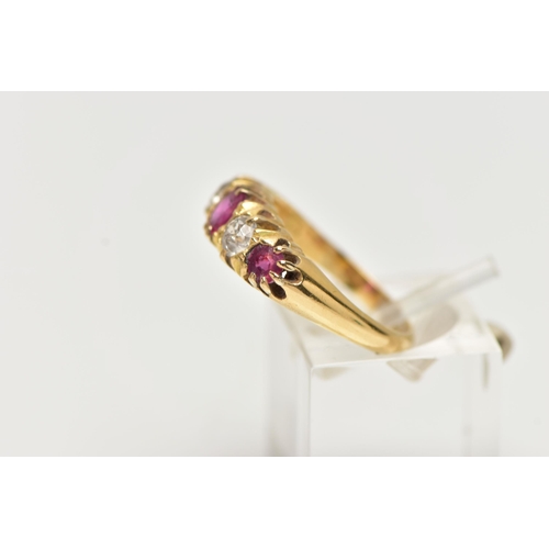 42 - AN EARLY 20TH CENTURY 18CT GOLD, RUBY AND DIAMOND RING, designed with three circular cut rubies, int... 