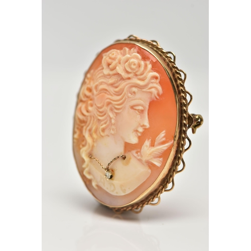 45 - A 9CT GOLD HABILLE CAMEO BROOCH, carved oval shell cameo, depicting a lady in profile, dressed with ... 