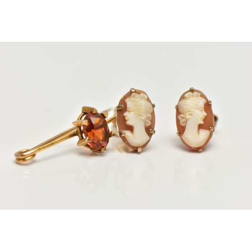 47 - A CITRINE BROOCH AND A PAIR OF CAMEO EARRINGS, the brooch claw set with an oval cut citrine, to the ... 