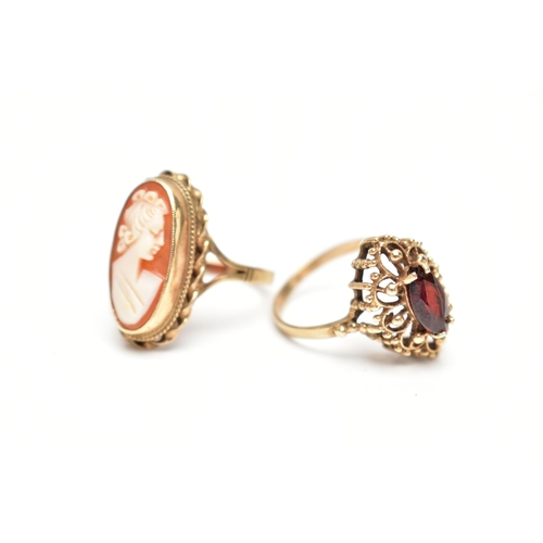 62 - TWO 9CT GOLD RINGS, the first a marquise cut garnet set within an open work beaded mount with a high... 