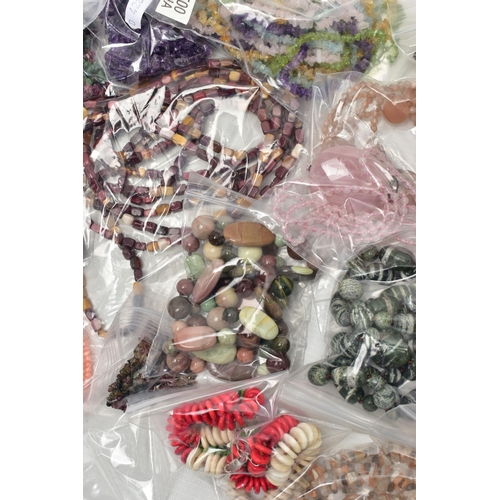 101 - A LARGE COLLECTION OF SEMI-PRECIOUS GEMSTONE JEWELLERY, to include a boxed pink agate pendant, in a ... 
