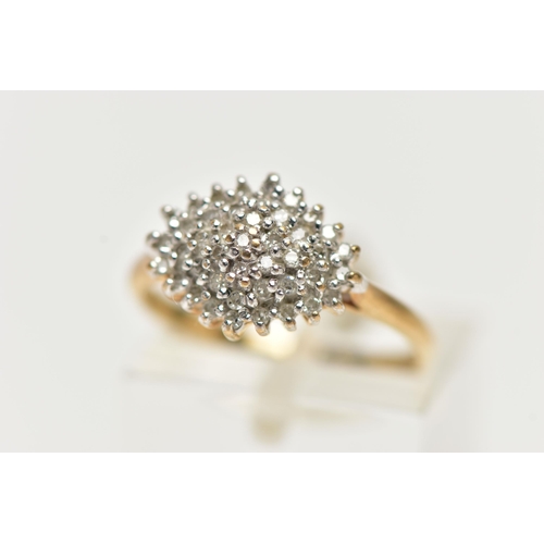 16 - A 9CT YELLOW GOLD, DIAMOND CLUSTER RING, of a marquise shape, set with single cut diamonds, pinched ... 