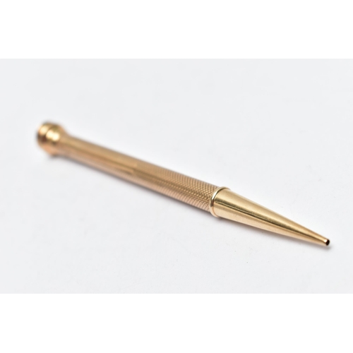 23 - A YELLOW METAL PROPELLING PENCIL, engine turned pattern stamped '9ct gold', AF terminal, length 115m... 