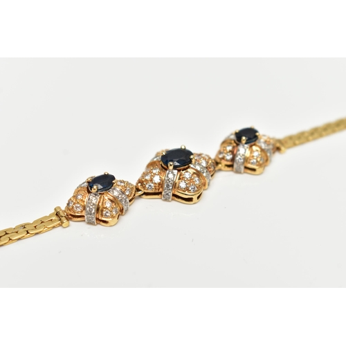 26 - A 18CT GOLD DIAMOND AND SAPPHIRE BRACELET, three oval cut blue sapphires each set in a quatrafoil mo... 