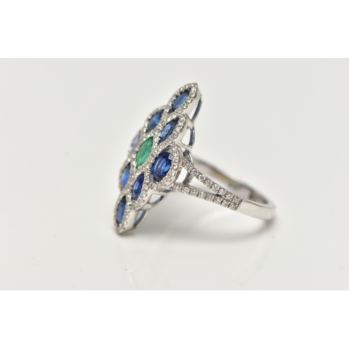 35 - AN 18CT WHITE GOLD GEM SET DRESS RING, of a marquise outline, set to the centre is an oval cut emera... 