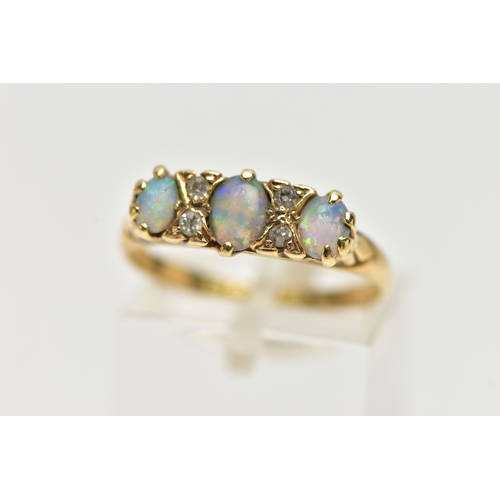 40 - AN EARLY 20TH CENTURY 18CT GOLD, OPAL AND DIAMOND RING, designed with three oval opal cabochons, eac... 