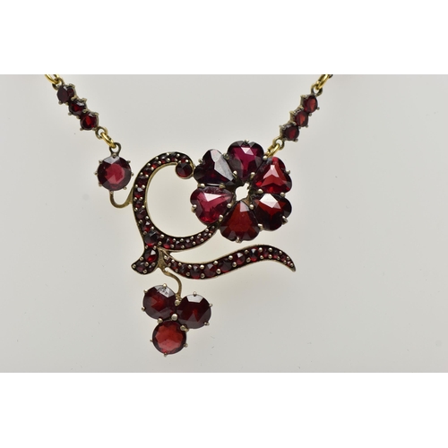 41 - A YELLOW METAL DIAMOND AND SAPPHIRE FIVE STONE RING AND A GARNET NECKLACE, the ring designed with th... 