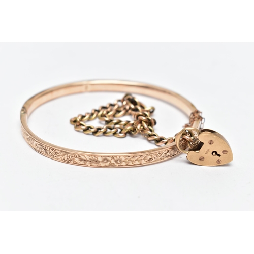 56 - A HINGED BANGLE AND A CURB LINK BRACELET, the floral decorated rose gold tone, hinged bangle, fitted... 