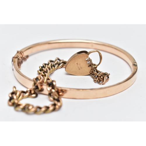 56 - A HINGED BANGLE AND A CURB LINK BRACELET, the floral decorated rose gold tone, hinged bangle, fitted... 