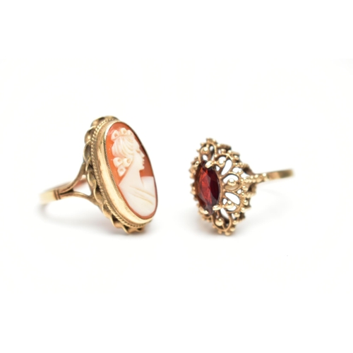 62 - TWO 9CT GOLD RINGS, the first a marquise cut garnet set within an open work beaded mount with a high... 