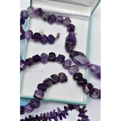 76 - TWO LARGE STATEMENT AMETHYST BEAD NECKLACES, the first a double row of irregular amethyst beads, fit... 