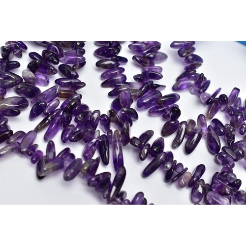 76 - TWO LARGE STATEMENT AMETHYST BEAD NECKLACES, the first a double row of irregular amethyst beads, fit... 