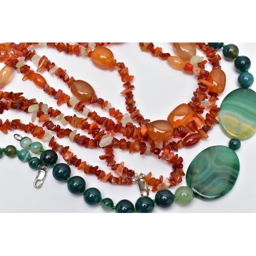 77 - TWO STATEMENT SEMI-PRECIOUS GEMSTONE BEAD NECKLACES, the first a triple row of vari cut carnelian be... 