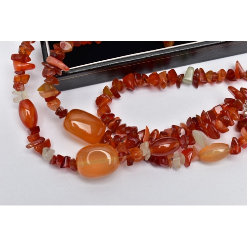 77 - TWO STATEMENT SEMI-PRECIOUS GEMSTONE BEAD NECKLACES, the first a triple row of vari cut carnelian be... 