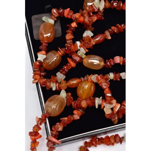 77 - TWO STATEMENT SEMI-PRECIOUS GEMSTONE BEAD NECKLACES, the first a triple row of vari cut carnelian be... 