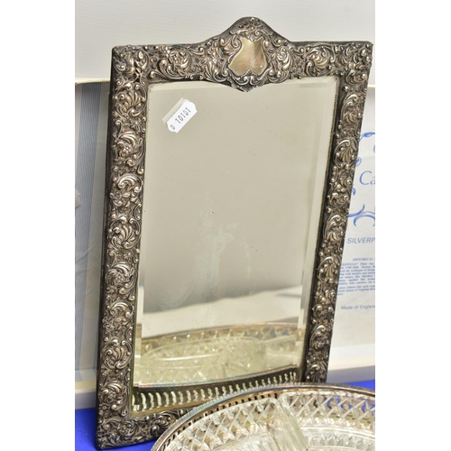 93 - A LATE VICTORIAN SILVER FRAMED VANITY TABLE MIRROR AND A SILVER PLATED SERVING TRAY, the rectangular... 