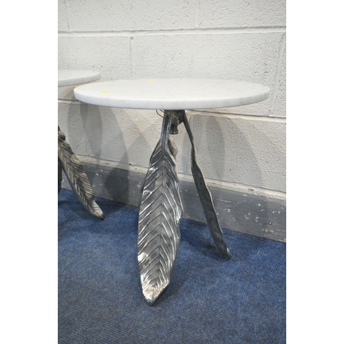 1195 - A PAIR OF WHITE CIRCULAR MARBLE TOP SIDE TABLES, on a three silvered leaves support, diameter 41cm x... 