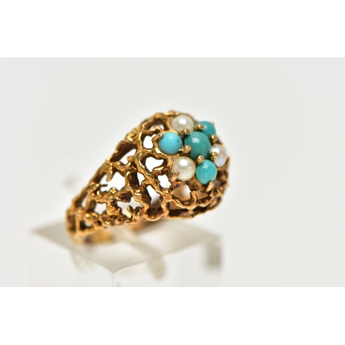 14 - A YELLOW METAL GEMSET DOME RING, a textured open work ring, cluster set with three split pearls and ... 