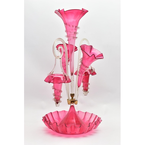 114 - A VICTORIAN CRANBERRY AND CLEAR GLASS EPERGNE, the central trumpet with trailing decoration, enclose... 