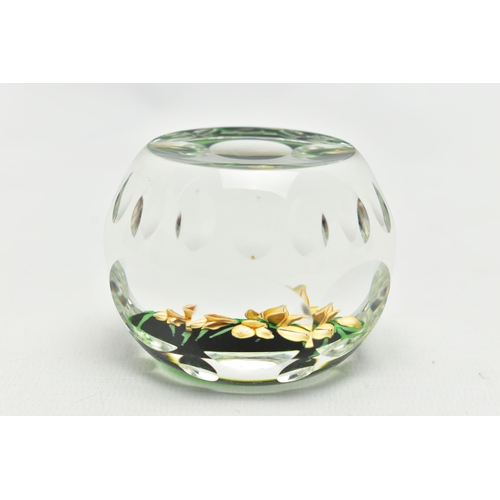 118 - A PERTHSHIRE GLASS PAPERWEIGHT, containing pale yellow buds and flowers on green stalks and 'P' in a... 