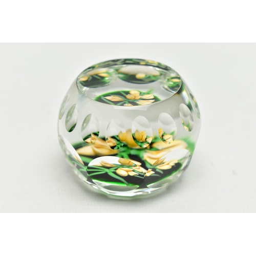 118 - A PERTHSHIRE GLASS PAPERWEIGHT, containing pale yellow buds and flowers on green stalks and 'P' in a... 