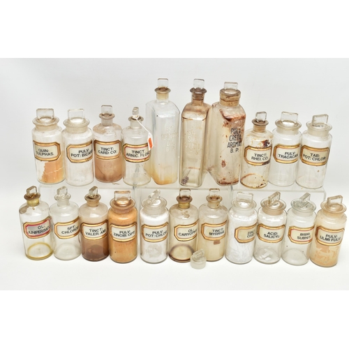 123 - A COLLECTION OF TWENTY ONE CLEAR GLASS PHARMACY BOTTLES WITH STOPPERS, three of rectangular form, ap... 