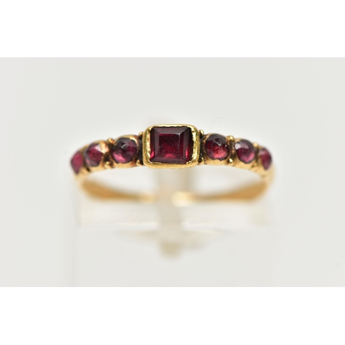 1 - A YELLOW GOLD GEORGIAN GARNET RING, the rectangular cut garnet flanked to each side by three garnet ... 