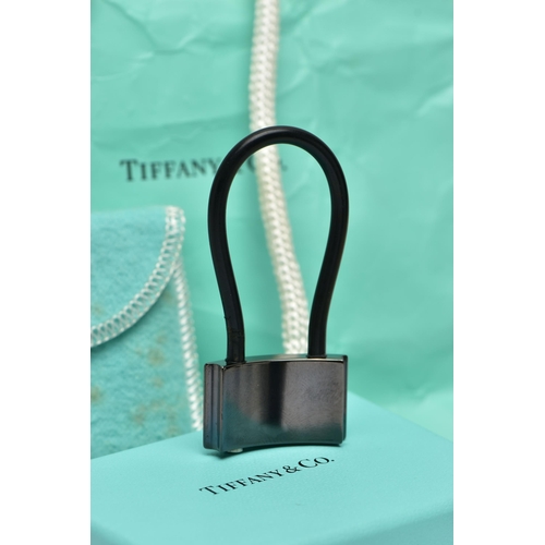 10 - A CASED TIFFANY & CO. PADLOCK, the black titanium padlock, with black rubber loop, signed 'NY T& Co.... 