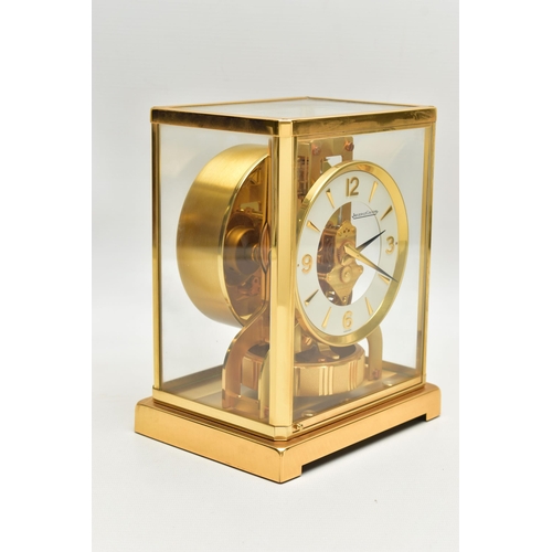 151 - A JAEGER-LE COULTRE 'ATMOS' MANTEL CLOCK, serial number 560516, in a brass and five panel glazed rec... 