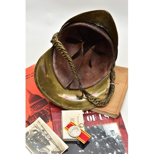 152 - A VICTORIAN BRASS MERRYWEATHER TYPE FIREMAN'S HELMET, with a worn leather and brass chin strap and l... 