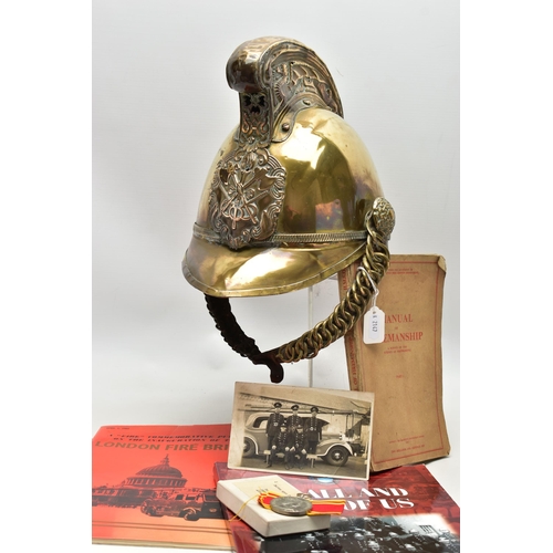 152 - A VICTORIAN BRASS MERRYWEATHER TYPE FIREMAN'S HELMET, with a worn leather and brass chin strap and l... 