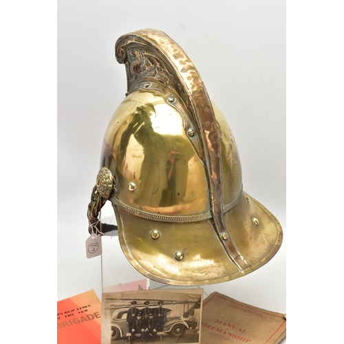 152 - A VICTORIAN BRASS MERRYWEATHER TYPE FIREMAN'S HELMET, with a worn leather and brass chin strap and l... 