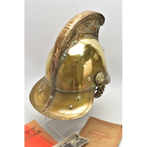 152 - A VICTORIAN BRASS MERRYWEATHER TYPE FIREMAN'S HELMET, with a worn leather and brass chin strap and l... 