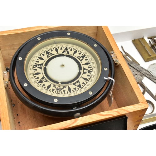 156 - A MID 20TH CENTURY JAPANESE SHIPS COMPASS HOUSED IN AN OAK CASE, the black lacquered compass in gimb... 