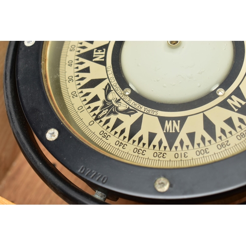 156 - A MID 20TH CENTURY JAPANESE SHIPS COMPASS HOUSED IN AN OAK CASE, the black lacquered compass in gimb... 